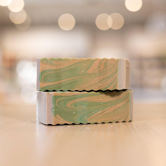 Two Commando Soap Bars with green and brown colors stacked on counter