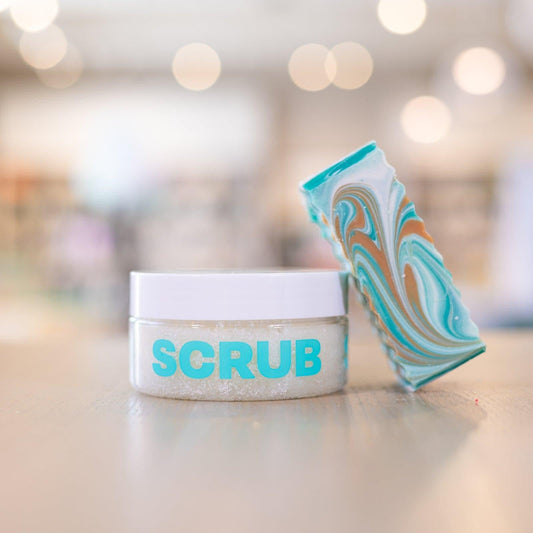 Narcissist Body Scrub with bar of Narcissist Bar Soap leaned against it