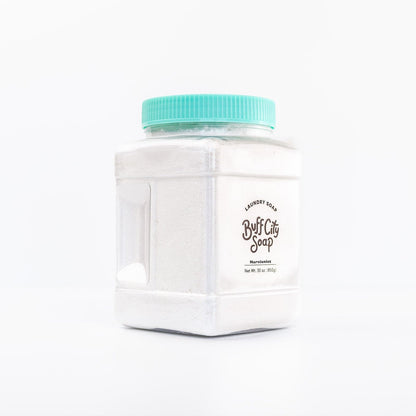 angled right view of clear container of Narcissist Laundry Soap